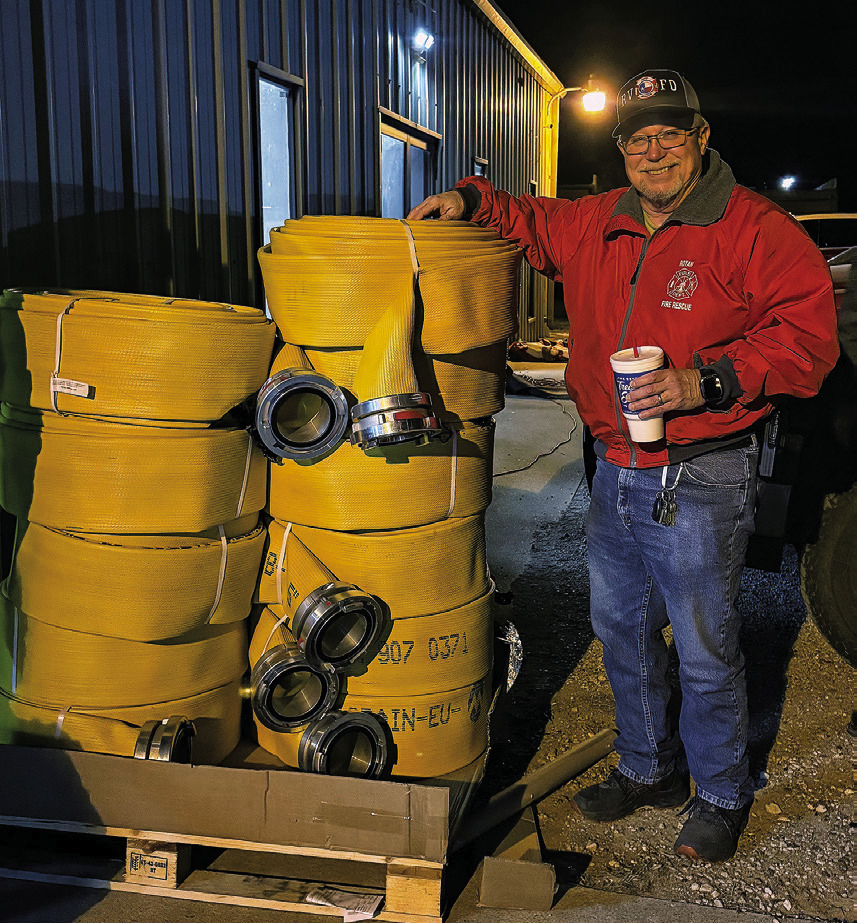 Fisher County Fire Marshall Robert Hoffman stands beside new fire hose purchased with help from a $10,000 IREN grant. The grant allowed the Rotan Volunteer Fire Department to equip Truck 87 with 1,100 feet of new hose. PHOTO BY CHEYANE HUSTON