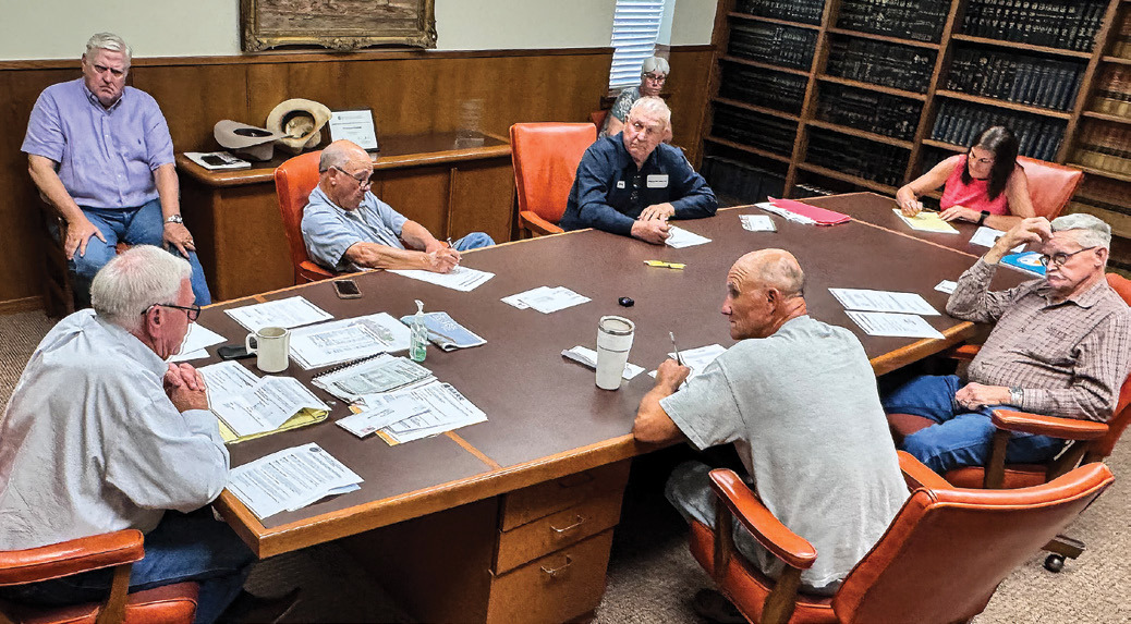 Stonewall County officials briefly share information in late September about the state’s review on data centers, which caused the county’s tax abatement hearing to be significantly delayed.
