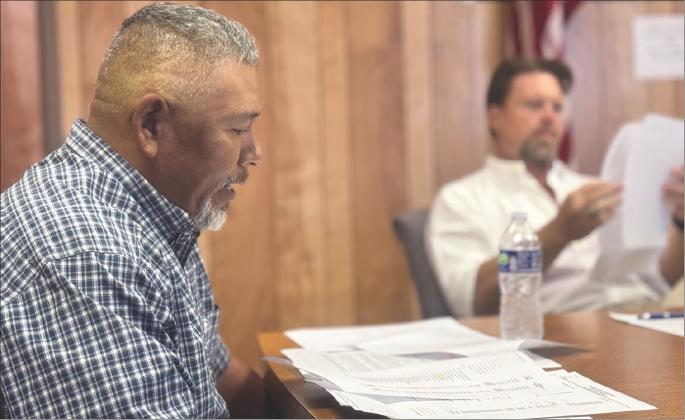 Aspermont City Administrator Lorenzo Calamaco outlines the financial details of what he said is one of the most challenging budgets to prepare as council members follow along ahead of adopting the proposed budget in tax rate. photo by jeff hurt