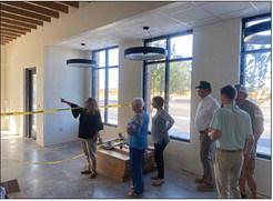 Fisher County Hospital CEO Leanne Martinez takes board members on a tour of the district’s new clinic and pharmacy as contractors work to complete the project in time for the grand opening something around October 1.