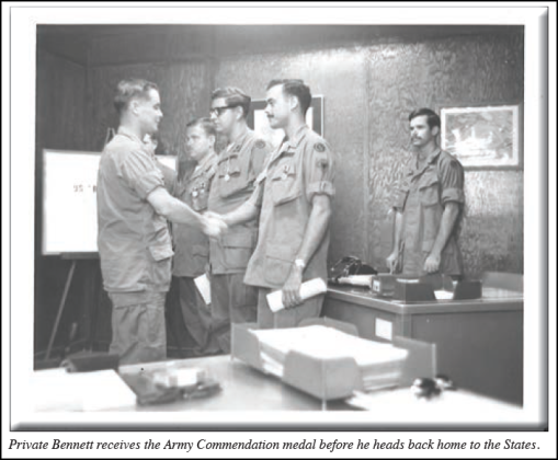 Private First Class Marshall Bennett receives the Army Commendation Medal before returning home to the United States.