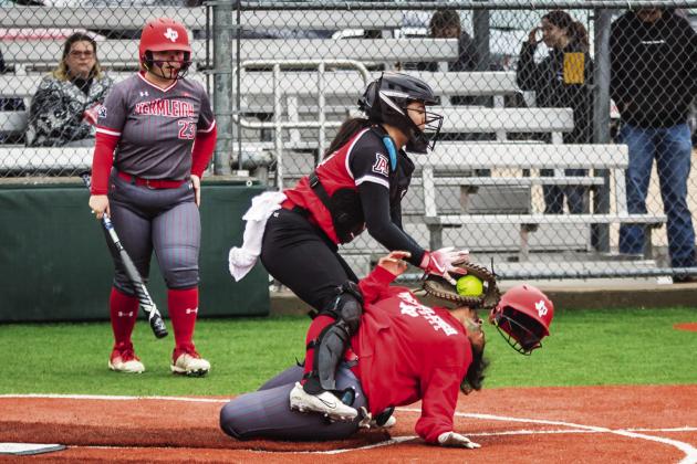 Aspermont catcher Peyton Calamaco collides with Lady Cardinal Syreah Callaway to get the out during the Lady Hornet's 0-10 loss to Hermleigh this past Saturday. Rainy conditions made for unstable play throughout the course of the game. Their next game will be on the 26th at home against Roby. Photo by: Mark Martinez