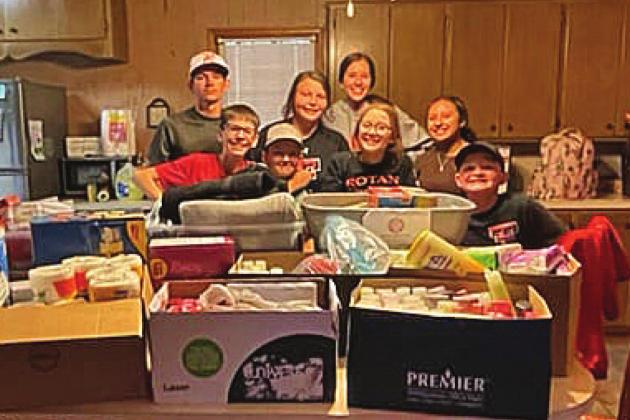 Pictured l to r: Rotan ISD students: Reese and Eli Weatherly, Gideon Preston, Chesney Fronterhouse, Kambrie Shelley, Avery Gonzalez, Chyanne Gaspar and Tucker McWilliams collect and load up supplies for Rotan ISD's IT Director Randy Hodges to take to Eastland.