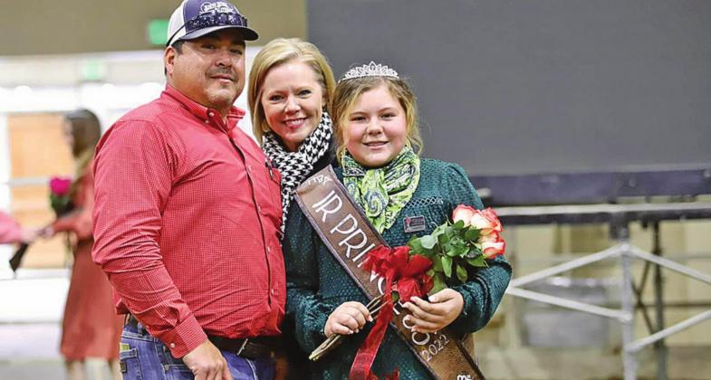 Madalyn Gonzales stands with her parents, Ruben and TeriJo, after being crown Miniature Hereford Breeders Association Junio Princess at the National Western Stock Show in Denver, Colorado.. Photo Courtesy of TeriJo Gonzales.