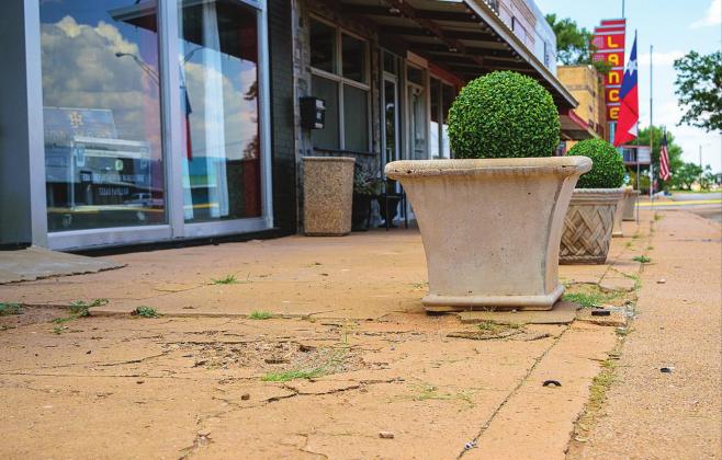 The City of Rotan is looking to replace the sidewalk on this, and three other downtown blocks. The remaining blocks, including the one in front of the Lance Theater will be considered in future grant cycles.