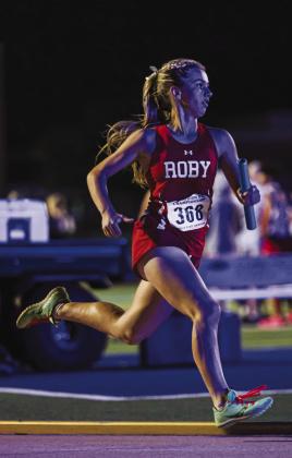 Roby's Lilly Benson begins her lap in the Mile Relay Final. The Lady Lion Mile Relay team would finish first, sealing their position at the top of the team standings. PHOTO BY MARK MARTINEZ