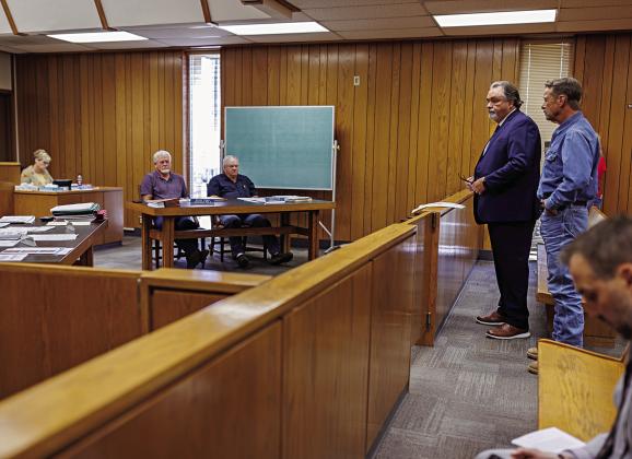 Joe Nixon brought attorney Kenny Maxwell to address the Fisher County Commissioners Court this month to seek assistance with getting County Road 346 repaired before someone had an accident due to the poor driving conditions. (PHOTO BY TRICIA HURT)