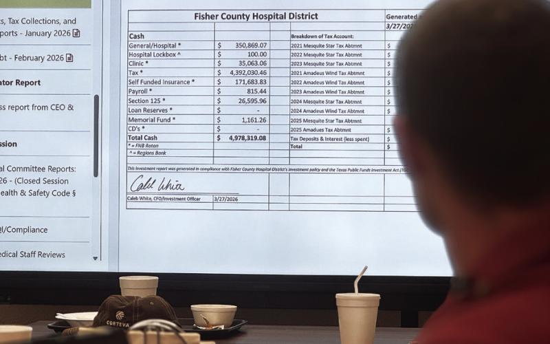 Fisher County Hospital District CFO Caleb White reviews financial reports with directors during the March meeting, saying he was happy with the balances at the start of the year. PHOTO BY JEFF HURT