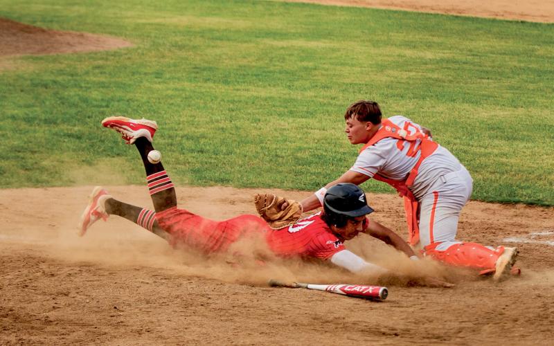 Roby’s Kameron Blassingame dives to beat the throw to home during the final game of the regular season finale series between Roby &amp;amp; Rotan on Monday night. Photo by: Mark Martinez