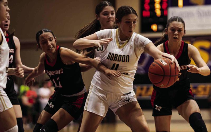 Lady Hornets Emilee Silva (left) &amp;amp; Maleah Hecht (right) battle with Lady Horns for a loose ball. Photo by: Mark Martinez
