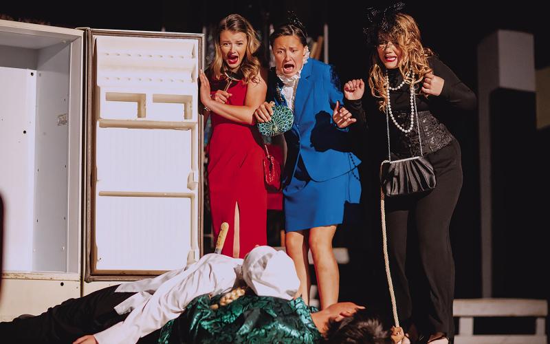 Roby CIS OAP performance of “Clue” Staleigh Young and Kailyn Shipp, and Christy Kelley gasp as a dead body falls out of the refrigerator. PHOTO BY MARK MARTINEZ