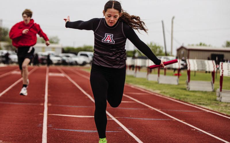 Aspermont's Macy Morris crosses the finish line during the 4x100 M Relay Photo by: Mark Martinez