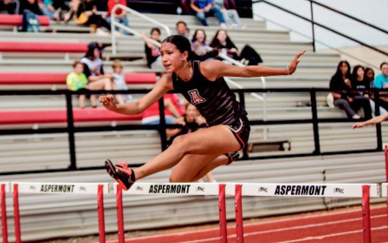 Aspermont’s Emilee Silva running the 100m Hurdles.