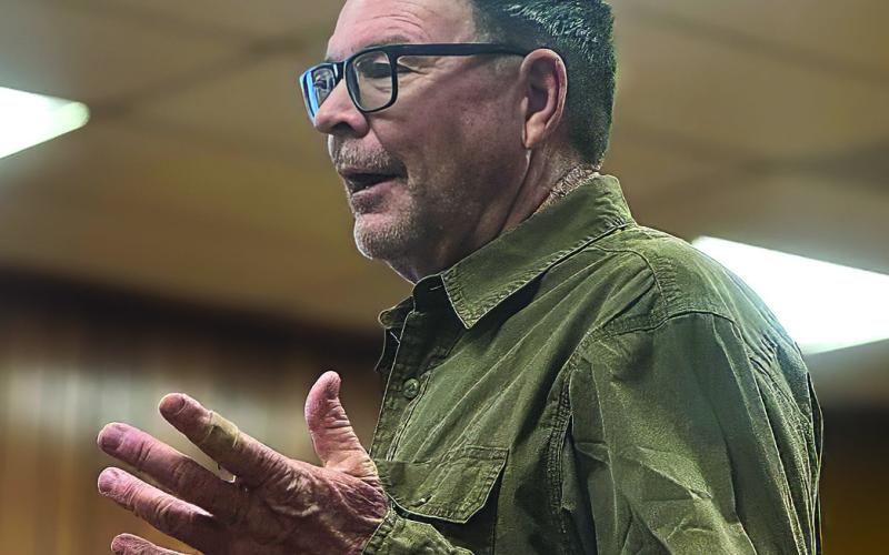 Local resident Kit Page addresses the Fisher County Commissioners Court during the February meeting, raising concerns about the proposed data center and renewable energy developments near his ranch south of Sylvester. Photo By JEFF HURT