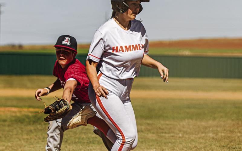 Rotan's Kayleigh Price dodges Aspermont pitcher Grayson English at home plate to score a run during the Hammers 18-5 win over the Hornets last Friday. PHOTO BY: MARK MARTINEZ