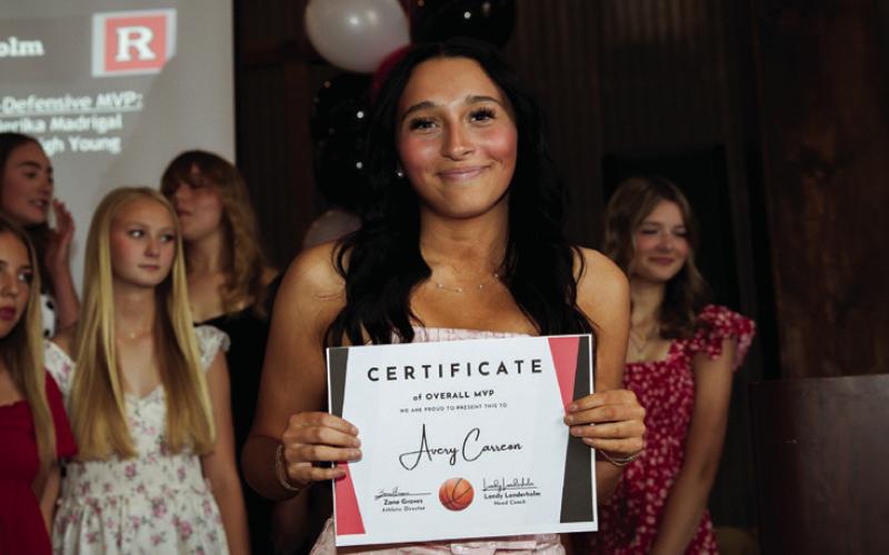 Sr. Avery Carreon recieves the Lady Lion Basketball MVP Award.