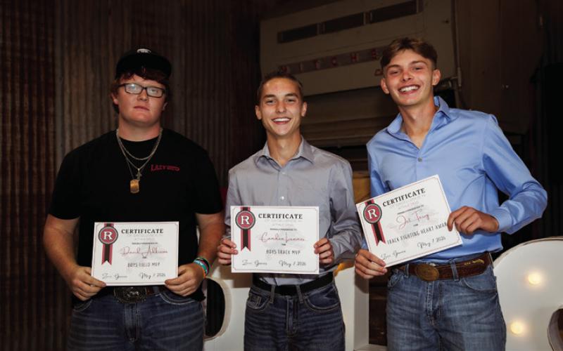 Sr. David Adkisson recieves Lion Field MVP, jr. Cammden Lummus recieves Lion Track MVP, and Fr. Jet Terry recieves Lion Fighting Heart Award for Lion Track.