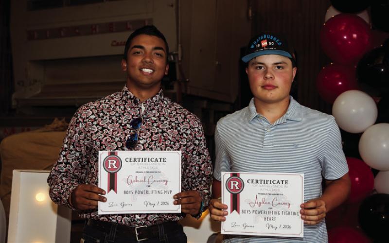 Sr. Gabriel Cerveny recieves Lion Powerlifting MVP Award while jr. Ayden Carney recieves Lion Powerlifting Fighting Heart Award.