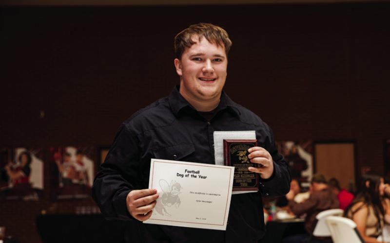 Sr. Tyler Kessinger recieving Aspermont Football’s Dog of Year Award.
