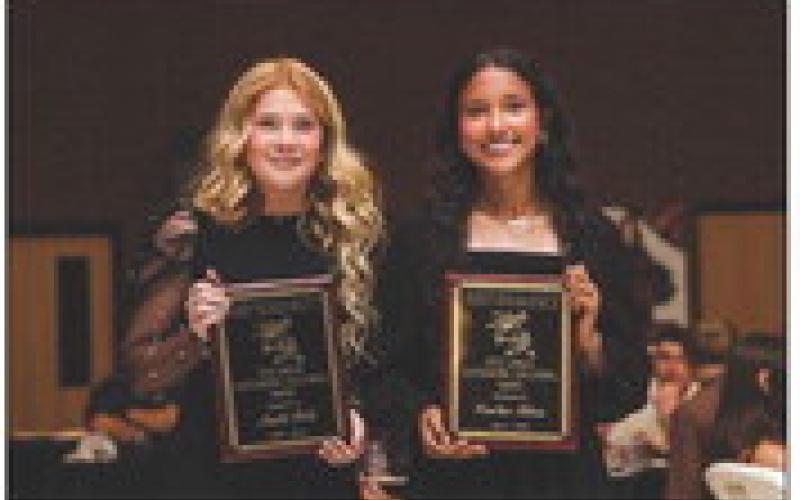 Matti Polk &amp;amp; Emilee Silva recieving the Vicki Griggs Outstanding Volleyball Award.