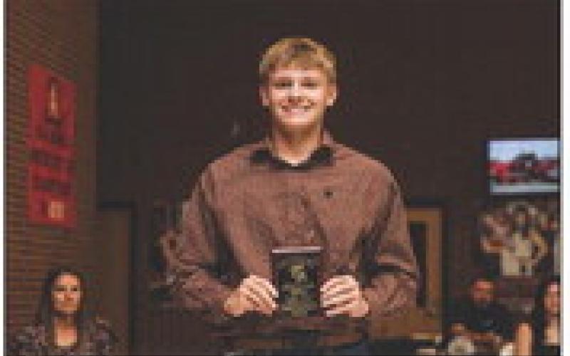 Fr. Payce Potts recieving Hornet Baseball’s Most Valuable Player Award.