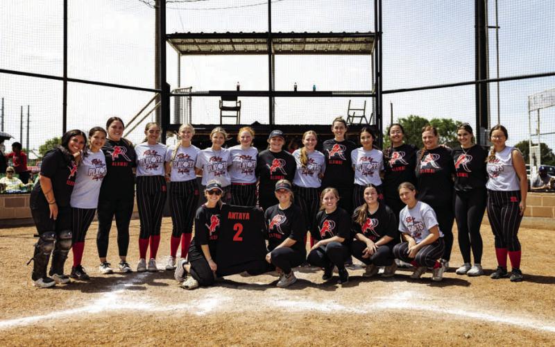Current and former members of the Roby Lady Lion Softball program pose together upon conclusion of their first end of the year Alumni Softball Game this past Sunday. The Roby Lady Lions were able to top the Lady Lion Alumni team 15-5 after three innings, but both sides showed great fight nonetheless. In addition, both teams honored late alumni player Jennifer Antaya and her family with a commemorative jersey. Photo by: Mark Martinez