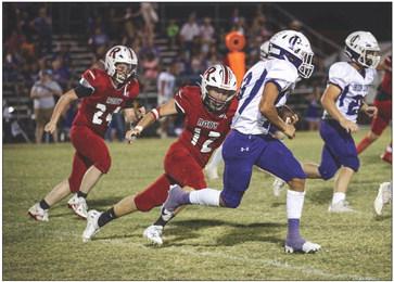 Lion Junior Brady Etheredge pursues the Hornet ball carrier during the Lions 6-54 loss to Irion County this past Friday. Photo by Tricia Hurt