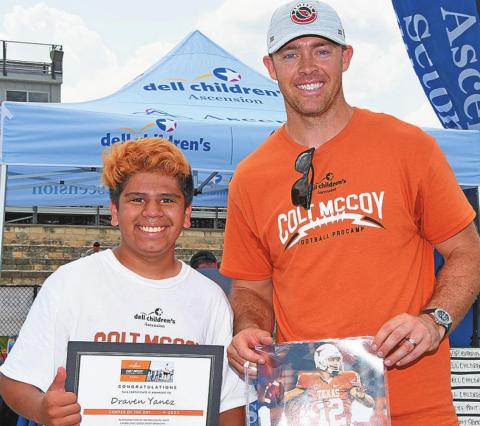 Draven Yanez of Rotan ( left) is awarded Camper of the Day at the Colt McCoy Youth Pro-Camp in Austin, TX. The son of Zach &amp; Rose Yanez of Rotan, Draven (12) will be entering the 7th Grade where he intends to play Jr. High Football for the Yellowhammers.