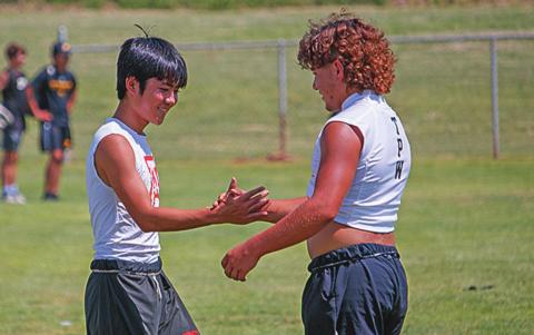 Aspermont's Toma Onishi &amp; Rotan's Zac Flores shake hands.