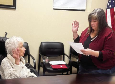 SMHD Human Resources Director Maryellen Coats gives newly appointed SMHD Director Claire Clarke her oath of office during the board’s January 12 meeting. JEFF HURT
