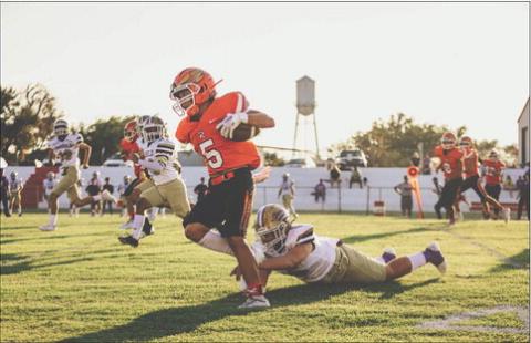 Rotan Sophomore Cristian Garcia slips a defender for a big run during the Hammers 26-39 loss to the Harrold Hornets last Friday night. Photo by Mark Martinez