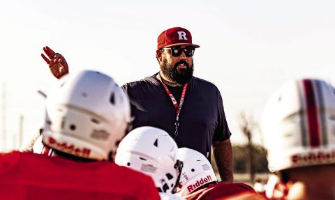 New Roby head coach/boys athletic director Zane Graves addresses the team post practice. Coach Graves arrives in Roby from Lubbock High and has also coached previously at Roscoe. This is his first year coaching at the six-man level. Photo by Mark Martinez