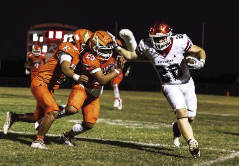 Hornet Senior Mason Brannan (right) fights off Rotan's Cristian Garcia &amp; Rhylon Lester (left) before being pushed out of bounds during Aspermont's 54-6 win over Rotan last Friday night. The win by Aspermont leveled out both team's overall records to 3-3 going into district play. The Hornets will take on the (3-3) Rule Bobcats Thursday night at 7pm in Aspermont, while the Hammers will take on the (3-2) Westbrook Wildcats Friday night at 7pm in Rotan. Photo by: Mark Martinez