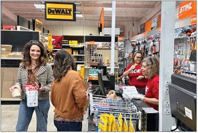 Rotan residence Buffy Sipe and Stephanie Huston share smiles in the checkout line at the newly opened Fisher Hardware &amp; Farm Supply store in downtown Rotan PHOTO BY MARK MARTINEZ.