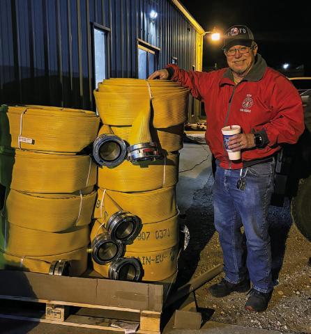 Fisher County Fire Marshall Robert Hoffman stands beside new fire hose purchased with help from a $10,000 IREN grant. The grant allowed the Rotan Volunteer Fire Department to equip Truck 87 with 1,100 feet of new hose. PHOTO BY CHEYANE HUSTON
