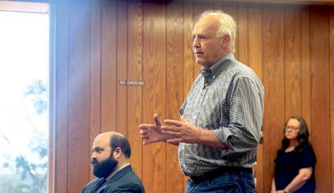CEO of GGS Energy David Ramm explains to commissioners the request to amend the tax abatement agreement due the change in project scope as Jake Lederle (left) Fisher County’s legal counsel with Wetsel &amp; Lederle LLP later confirmed.