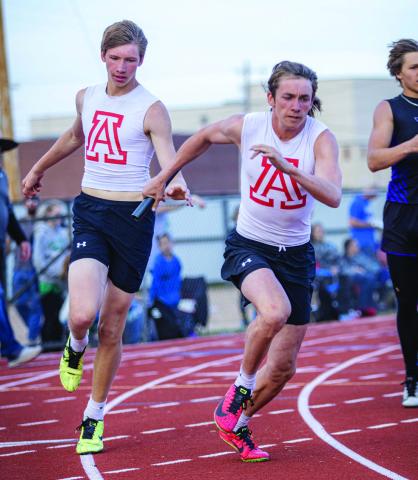 Aspermont's Sebastian Kordes handing off to Teammate Kade Morris in the 4x200m Relay. The team would finish 3rd in their heat and 5th overall in the event. Photo by: Mark Martinez