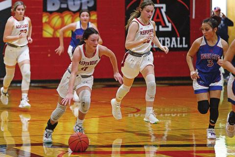 Lady Hornet Addi Shugart fast breaks down the court during Friday's 71-16 win over the Houndettes. Photo by: Mark Martinez