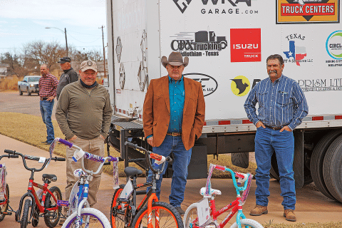 Larry Sauls (Pictured on the left) Rotan Methodist Pastor Jeff Sedberry and Members of the Methodist, Church of Christ and Baptist church of Rotan help unload the bicycles that were delivered Sunday