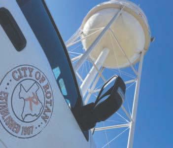 A view from alongside a city work truck shows the recently completed restoration of Rotan’s North Water Tower, freshly repainted and standing against the Autumn skyline.