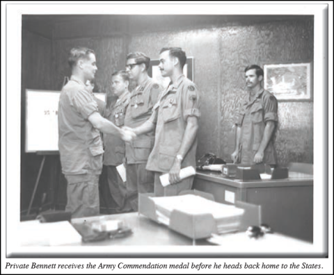 Private First Class Marshall Bennett receives the Army Commendation Medal before returning home to the United States.