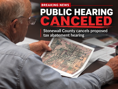 A Stonewall County official reviews project maps during an earlier discussion of the proposed Crusoe data center. The county has canceled Monday’s public hearing on a proposed tax abatement agreement, citing ongoing negotiations with Crusoe Energy Systems.