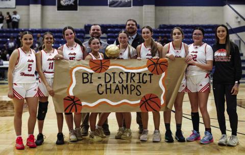 The Rotan Lady Hammers and their coaching staff with the Bi-District title after defeating Munday 38-32. Photo by: Mark Martinez
