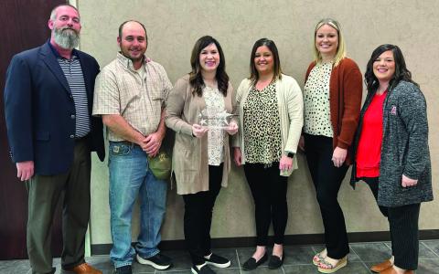 Friends and family were all in on the secret and had known for weeks that AISD's counselor, Teddye Myers had been selected as Counselor of the Year. Pictured l to r: AISD Superintendent Zach Morris, Tres and Teddye Myers, Charla Leonard HS Principal Tiffany Potts, &amp; Kristin Marsh.