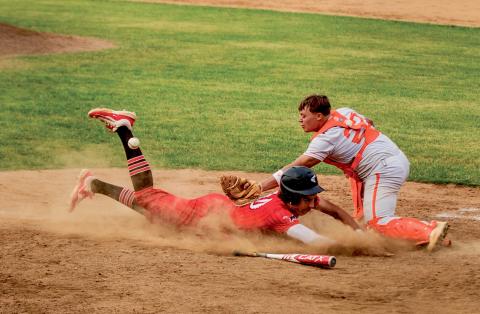 Roby’s Kameron Blassingame dives to beat the throw to home during the final game of the regular season finale series between Roby &amp; Rotan on Monday night. Photo by: Mark Martinez