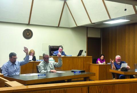 Fisher County commissioners Stuart Posey, Micah Evans, and Gordon Pippin vote unanimously to adopt the voter approved tax rate during last week’s special called meeting. Commissioner Dexter Elrod was absent.