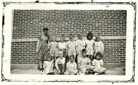 First grade Dowell 1941-42, Mrs. Gerald Collingsworth, teacher. Front row; L-R unknown, Arthur D. Greenway, Glena Faye Harrison, Jim Ashley, Eloisa Macias Back row; Mrs. Collingsworth, Medva Gartman, Darrell Hale, Jimmy Frank Wright, Doyce Ray Waddell, unknown, Frank Dean Montgomery