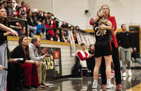 Aspermont's Coach Pott's hugs Senior Shelby Martin as the end of the final playoff game of the season
