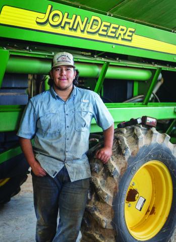 Aspermont ISD graduate and current TSTC student Mario Lopez stops to take a break on his job at United Ag &amp; Turf located in Rotan. PHOTO BY MARK MARTINEZ