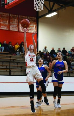 Rotan's Tylee Fillingim cuts through the Houndette defense to put a shot during the Lady Hammers' 46-32 win over Knox City last Friday night. Photo by: Mark Martinez
